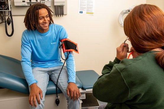 nurse taking a student's blood pressure