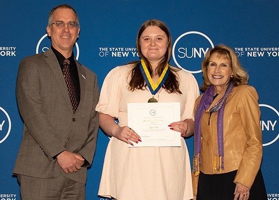 Paige Innis receiving award