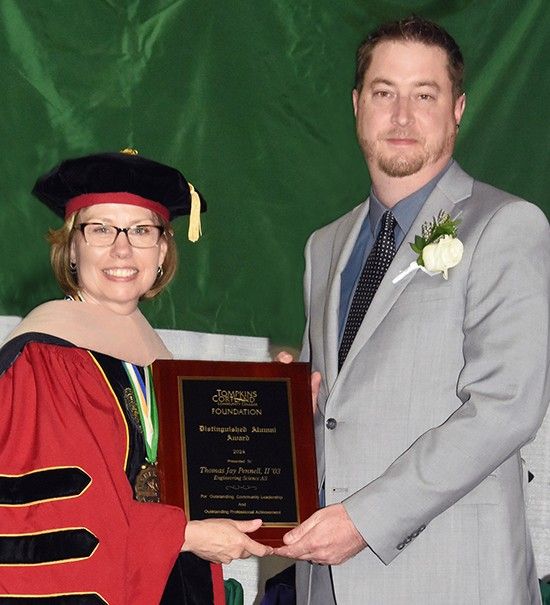 TC3 President Kremenek presenting plaque to 2024 Distinguished Alumni Winner Thomas Jay Pennell