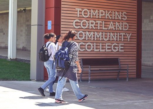 Students walking into campus building at Tompkins Cortland Community College