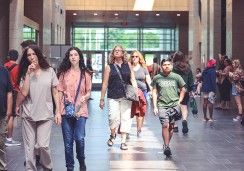 Students walking in the athletics facility atrium